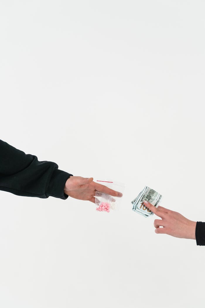 Conceptual image depicting the illegal trade of drugs for cash, demonstrating addiction.